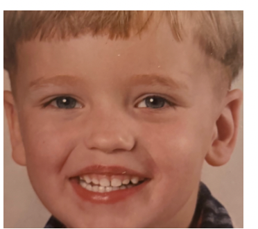 Yvo smiling as a child